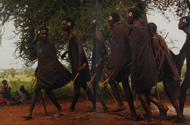The Maasai men wearing <i>insurutia</i> symbol on their ears. Source:&nbsp;T. Saitoti, Maasai, New York : Abradale Press, 1993, www.archive.org