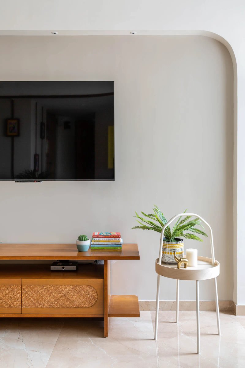 The TV unit is a refurbished piece of furniture with rattan details adding to the charm. Anuja Kambli
