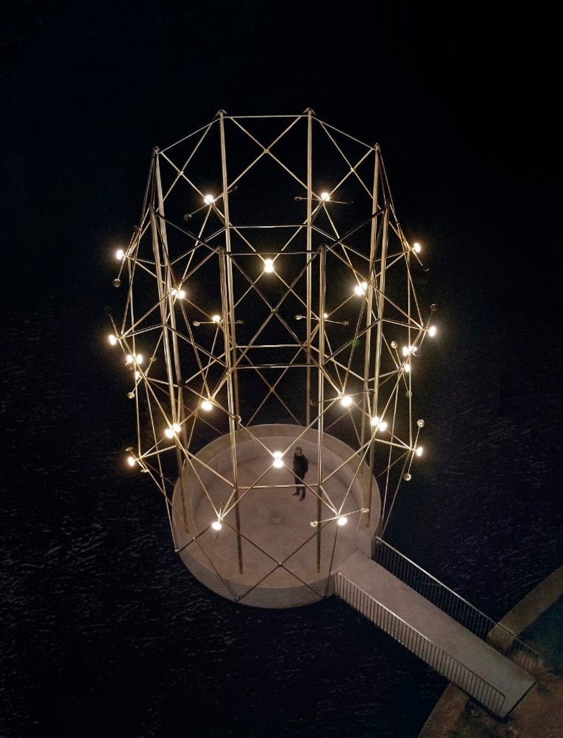 A night view of the Belvédère, featuring 32 luminous orbs that transform the pavilion into a lighthouse. Photography by © Yann Peucat.