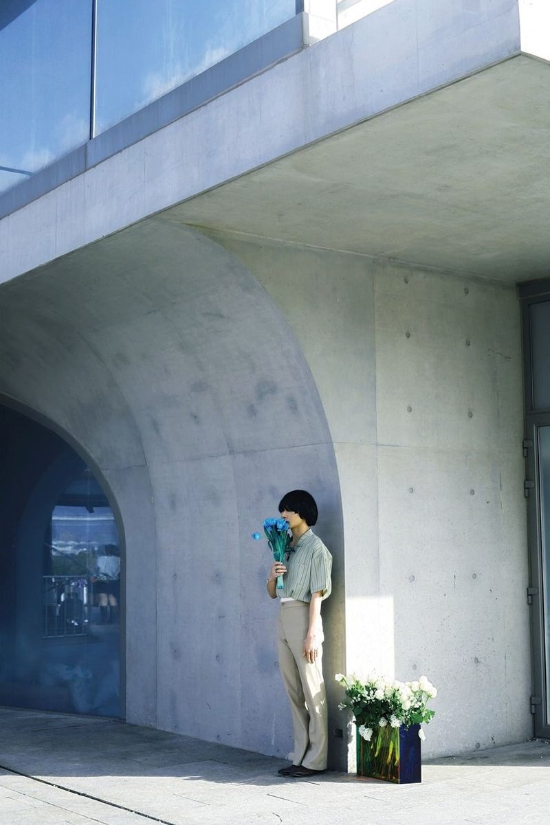 Contemplation in concrete: solitude amidst the urban landscape.