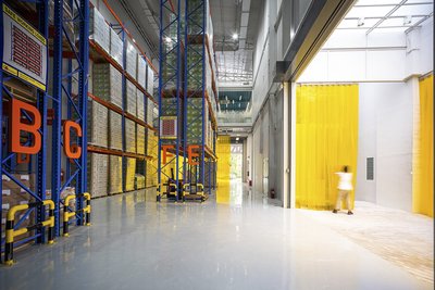 This architectural photograph showcases the interior of a modern warehouse, emphasizing its industri