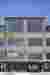 This architectural image showcases the facade of an industrial building, characterized by its corrug